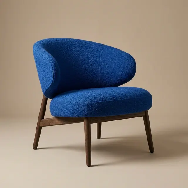 Cobalt-blue sculptural lounge chair on a neutral studio background